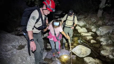 Helping a hiker across the creek