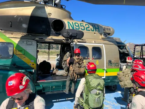 Boarding the Sheriff's helicopter